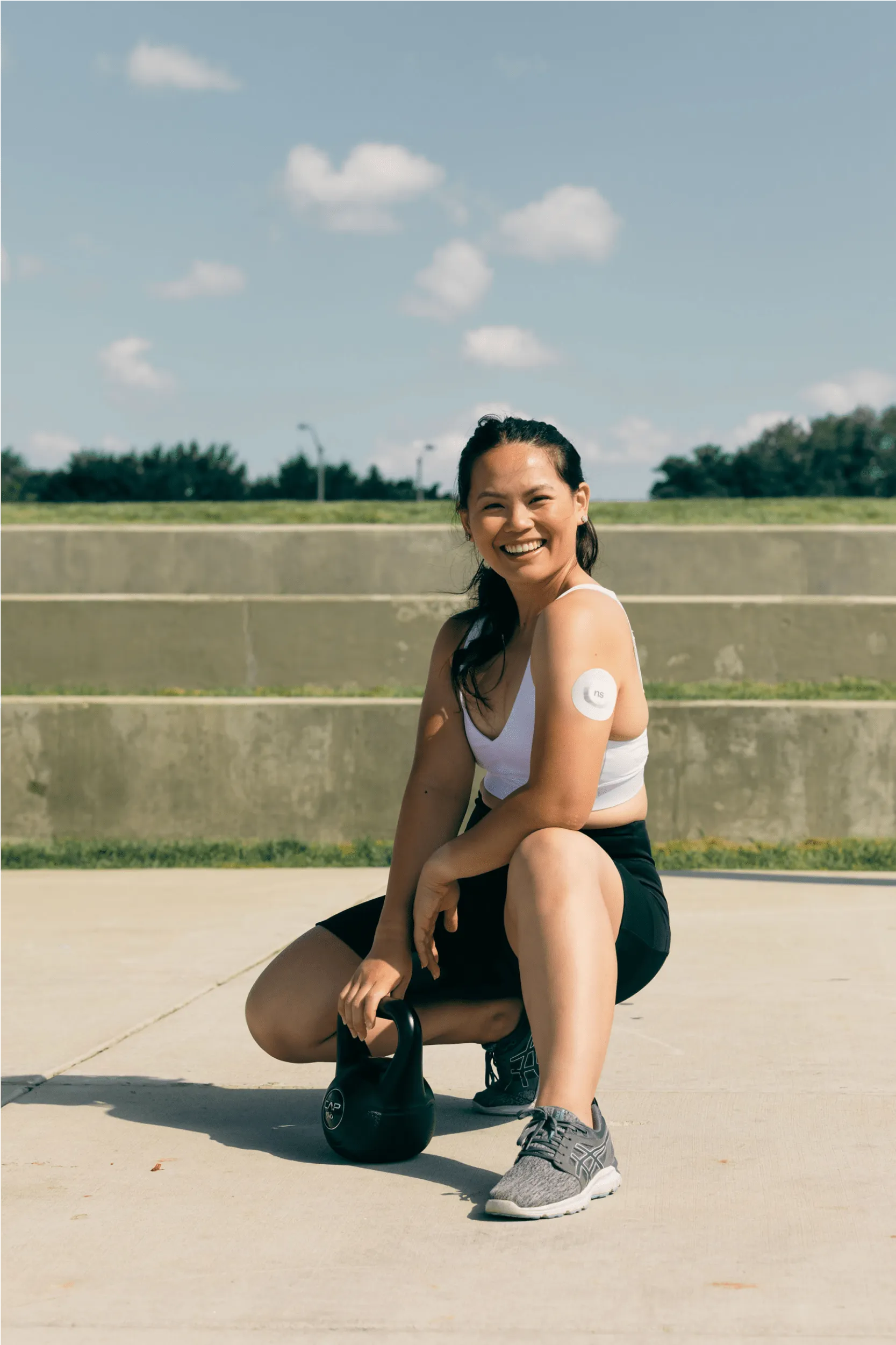 Women with CGM holding weights