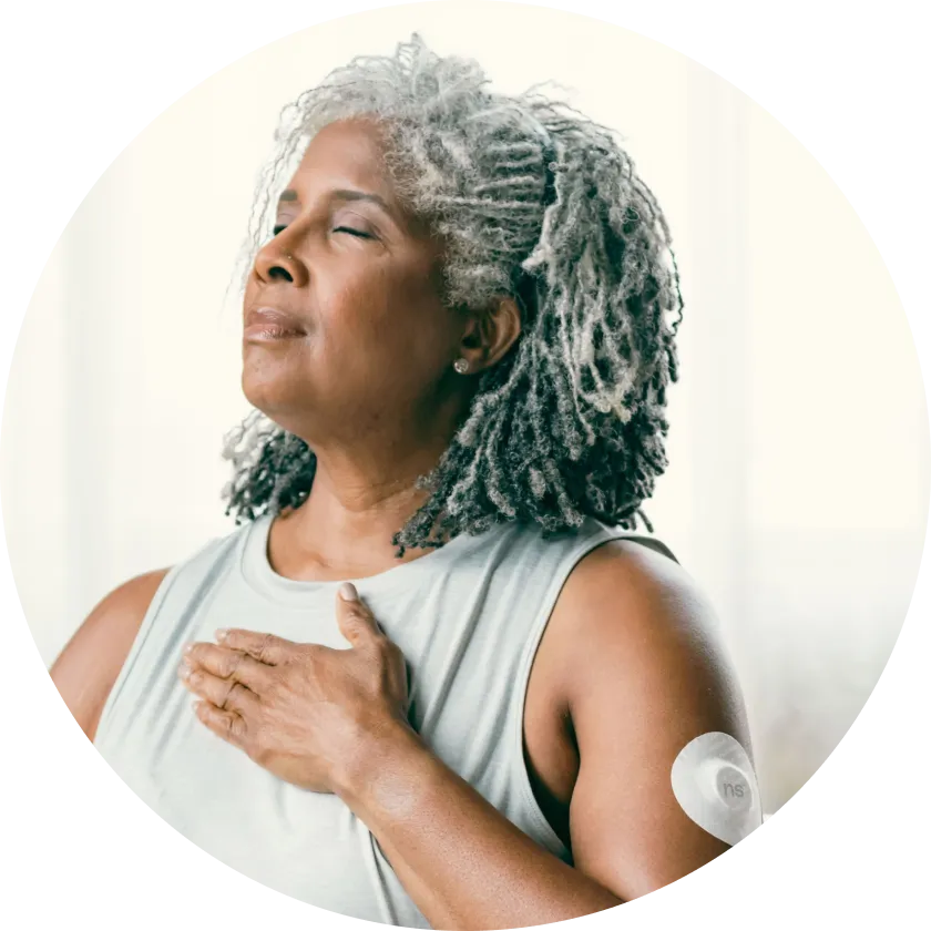 Women doing breathing exercises while wearing a Nutrisense CGM