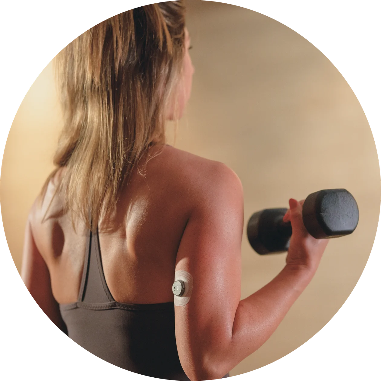 A back view side of a man doing physical exercise wearing Nutrisense cgm sensor on his upper right hand.