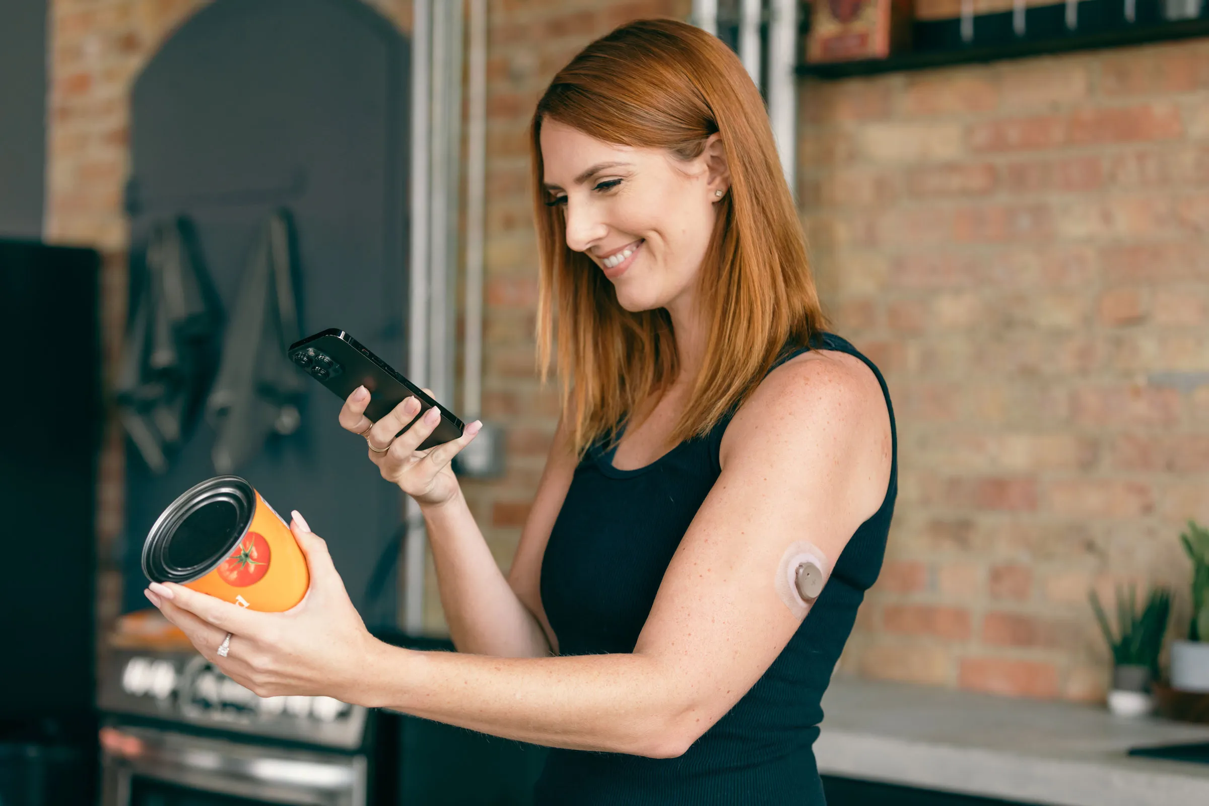 Woman wearing CGM scanning nutrition label