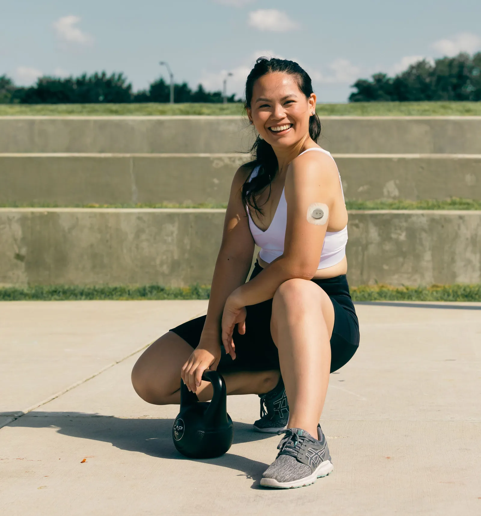 Women with CGM holding weights