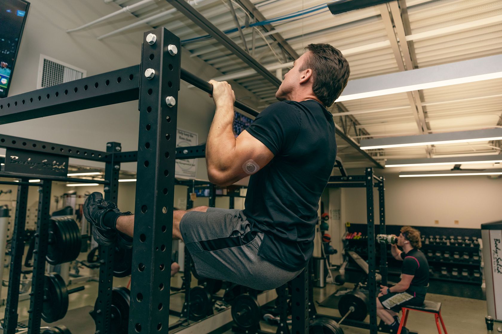 A man working out and wearing Nutrisense CGM