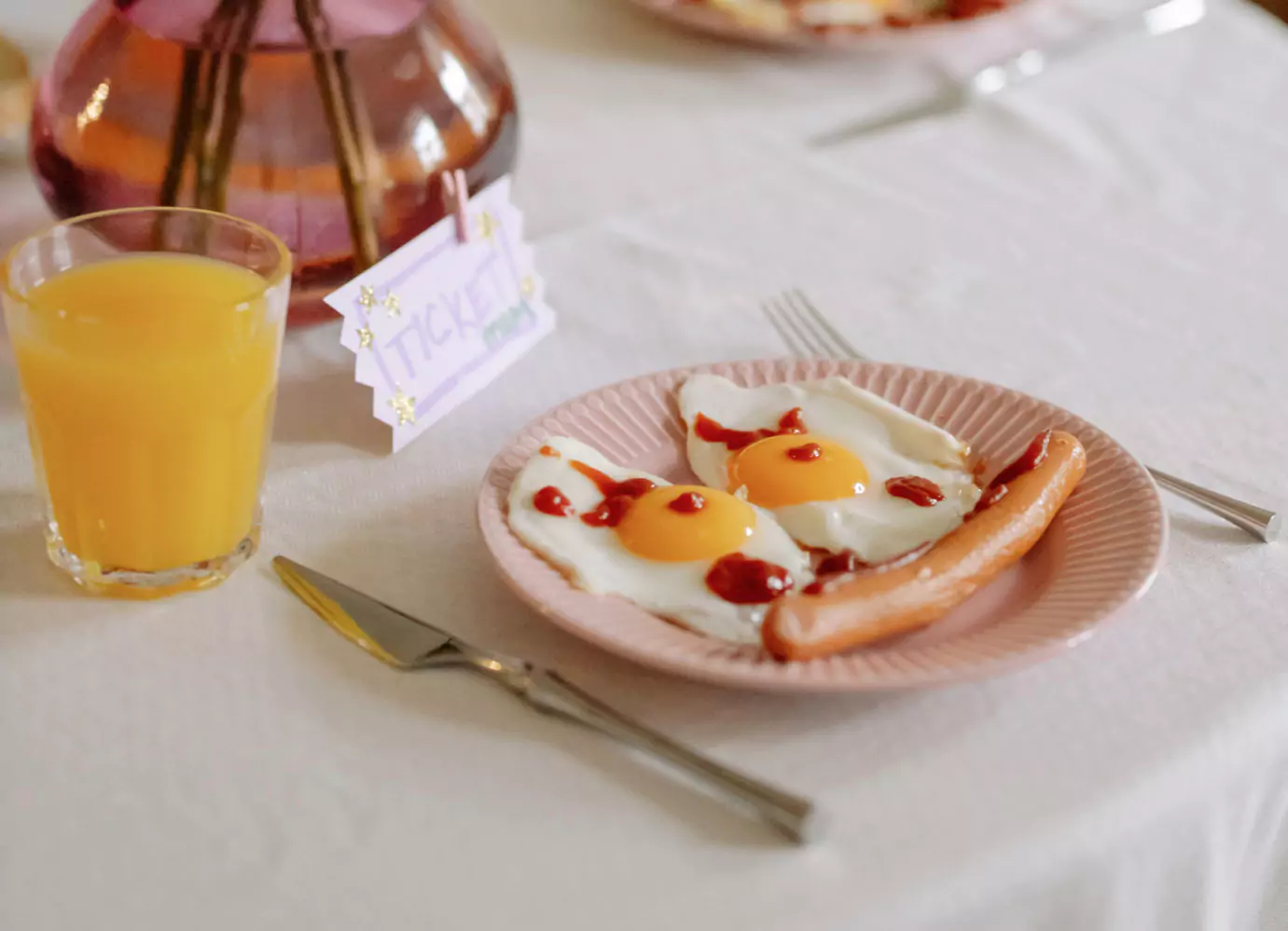 A plate with eggs and a sausage