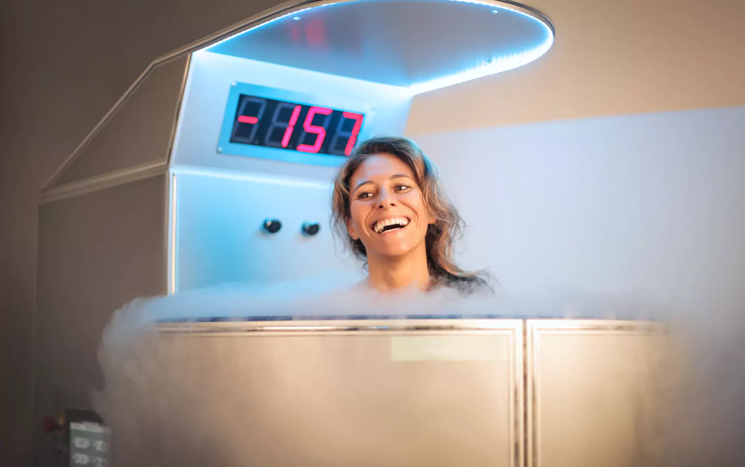 a smiling woman getting cryotherapy 