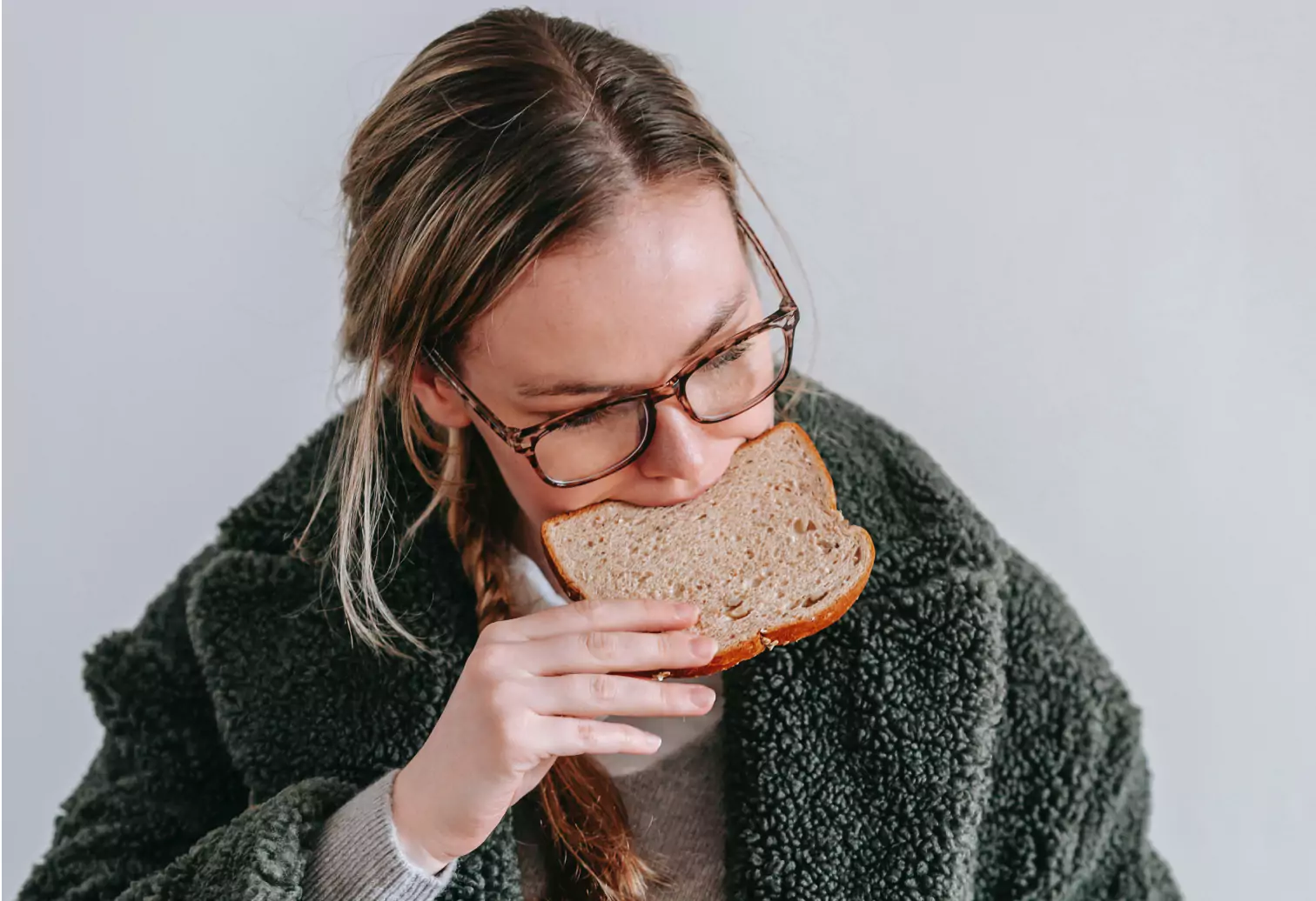 someone eating a slice of bread