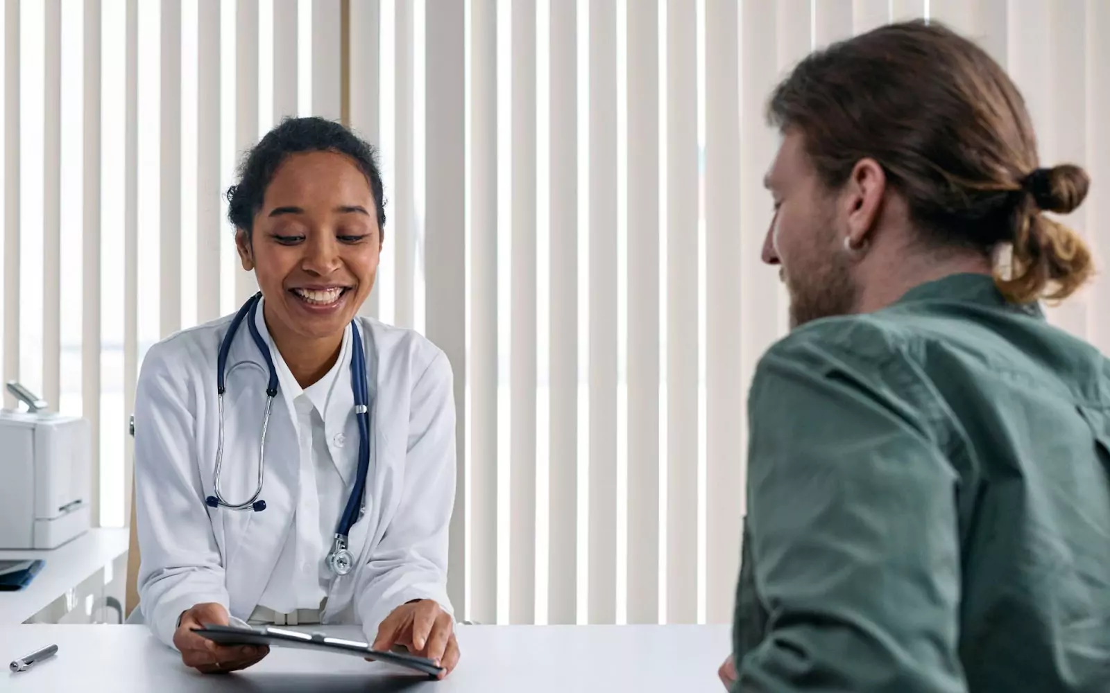 a doctor talking to a patient 