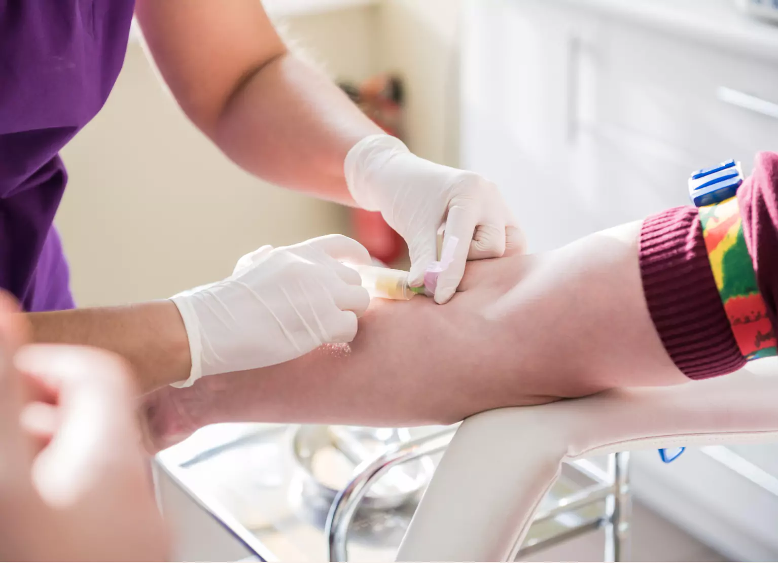 a nurse drawing a person's blood