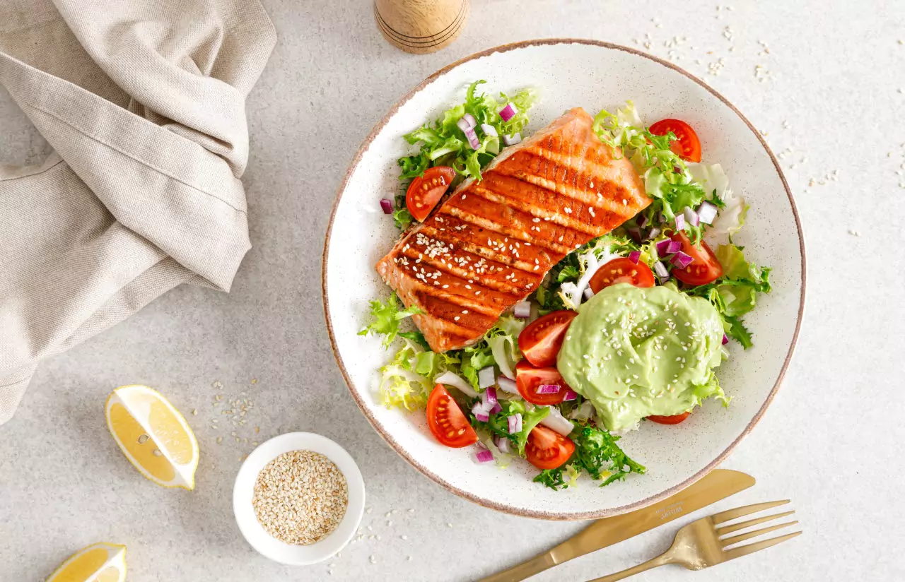 A plate of grilled fish and salad