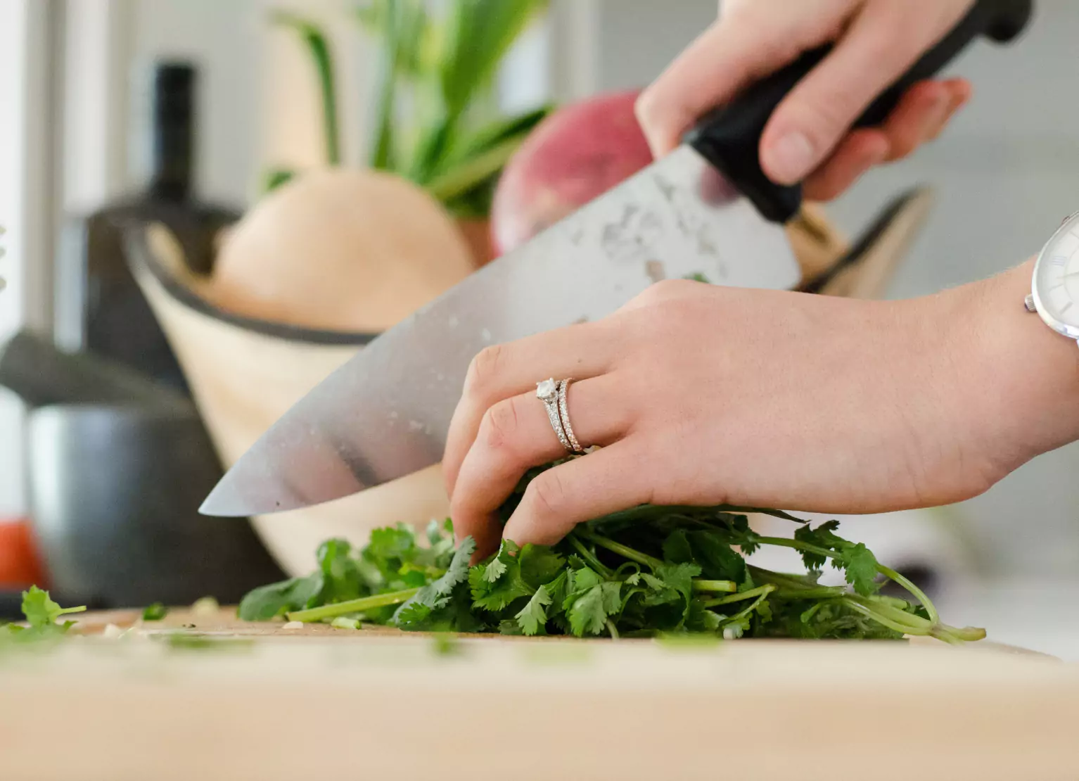a person cutting parsley