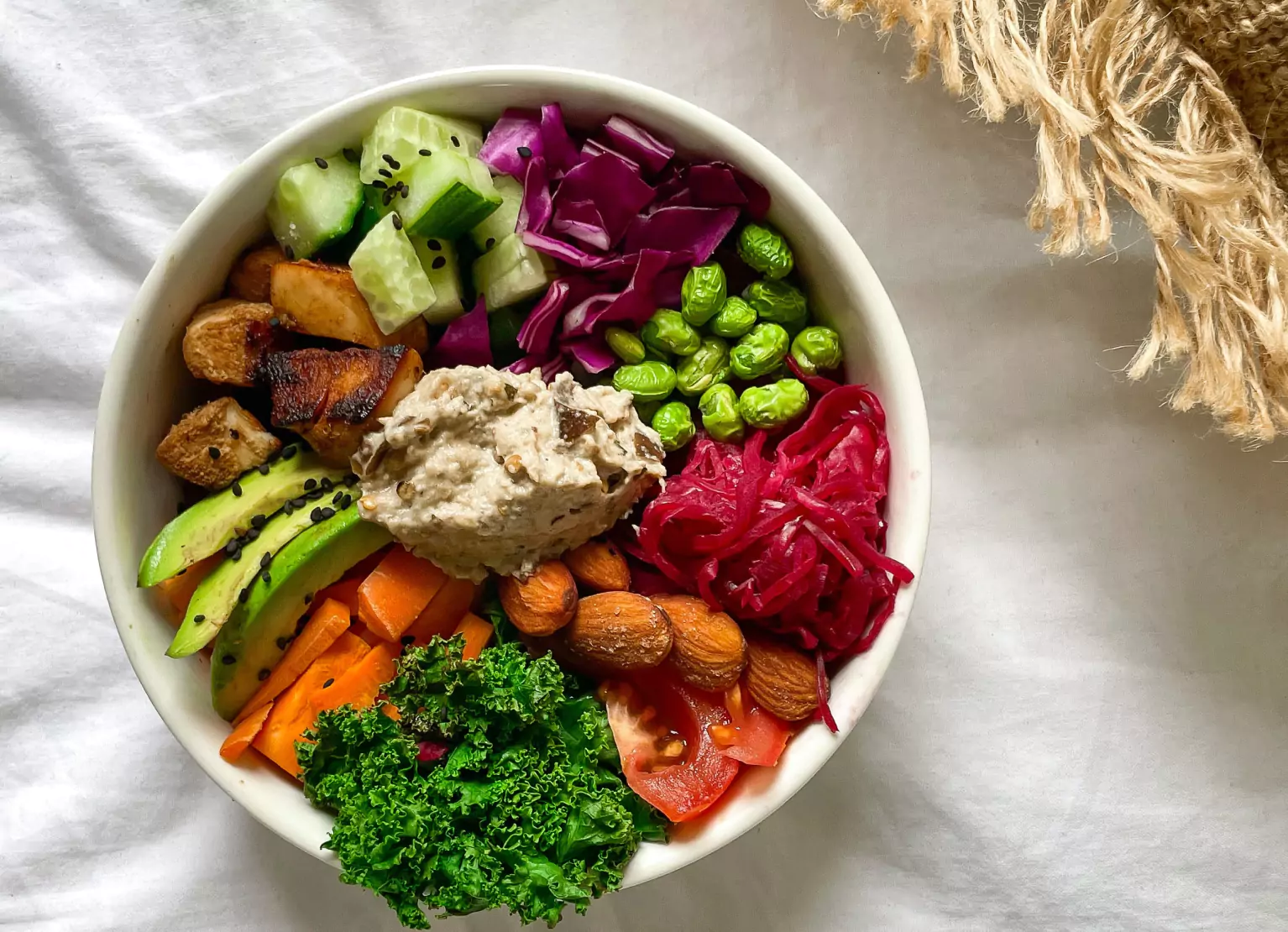 a garden bowl with potatoes and greens