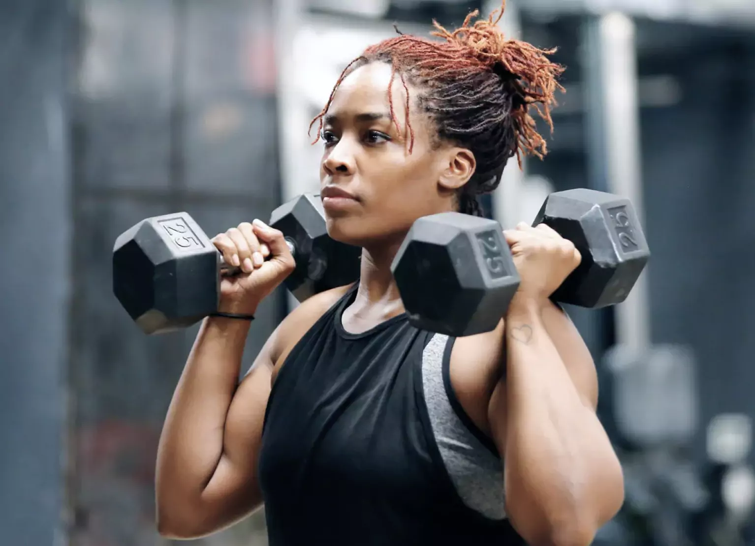 a person holding dumbbells