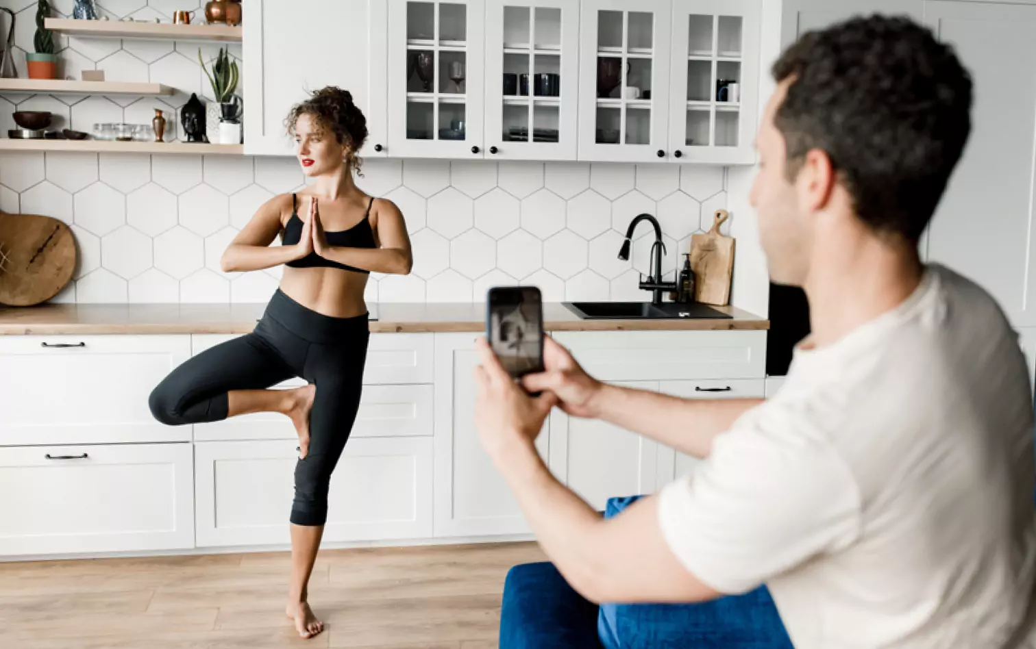 someone talking a picture of a girl working out 