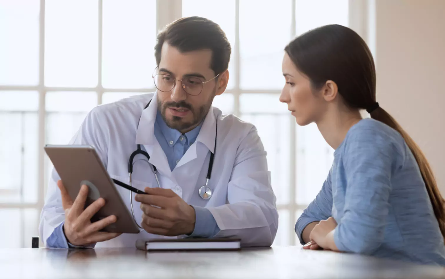 a doctor talking to a patient 