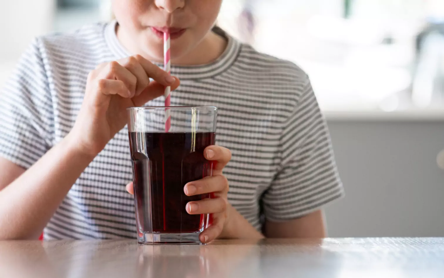 someone drinking a sugary drink