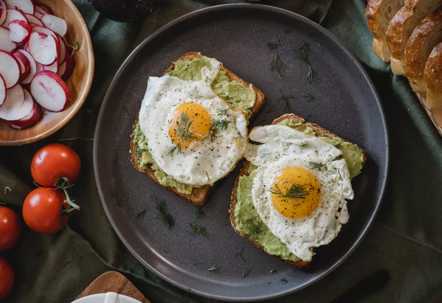 a plate of avocado toast with eggs