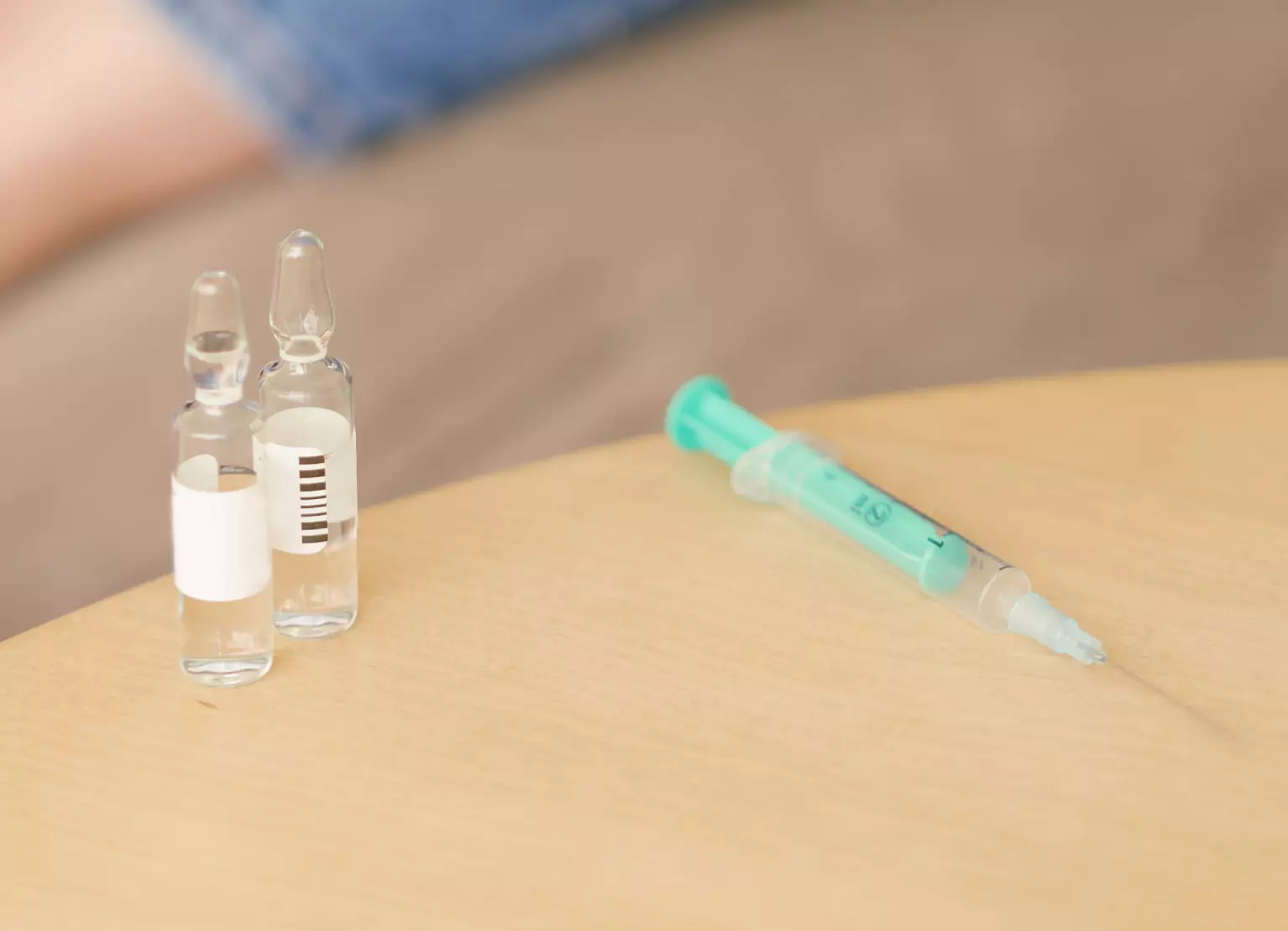 Table with insulin shots and needle