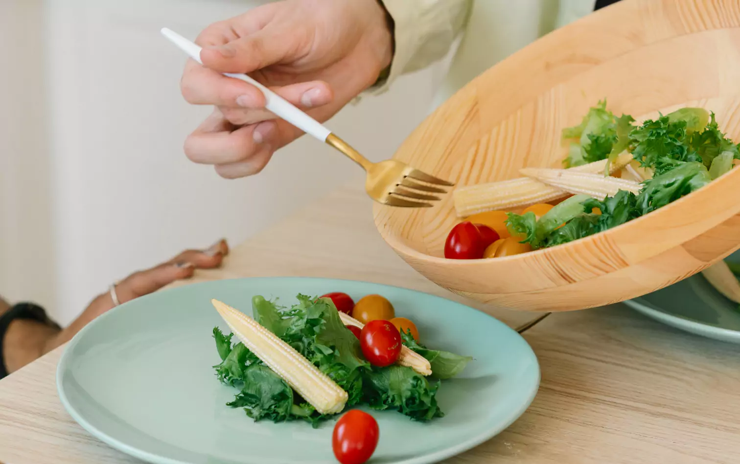 a person being served with a salad