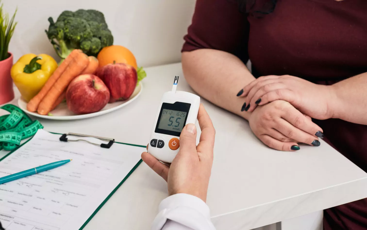 a doctor checking patient's glucose level