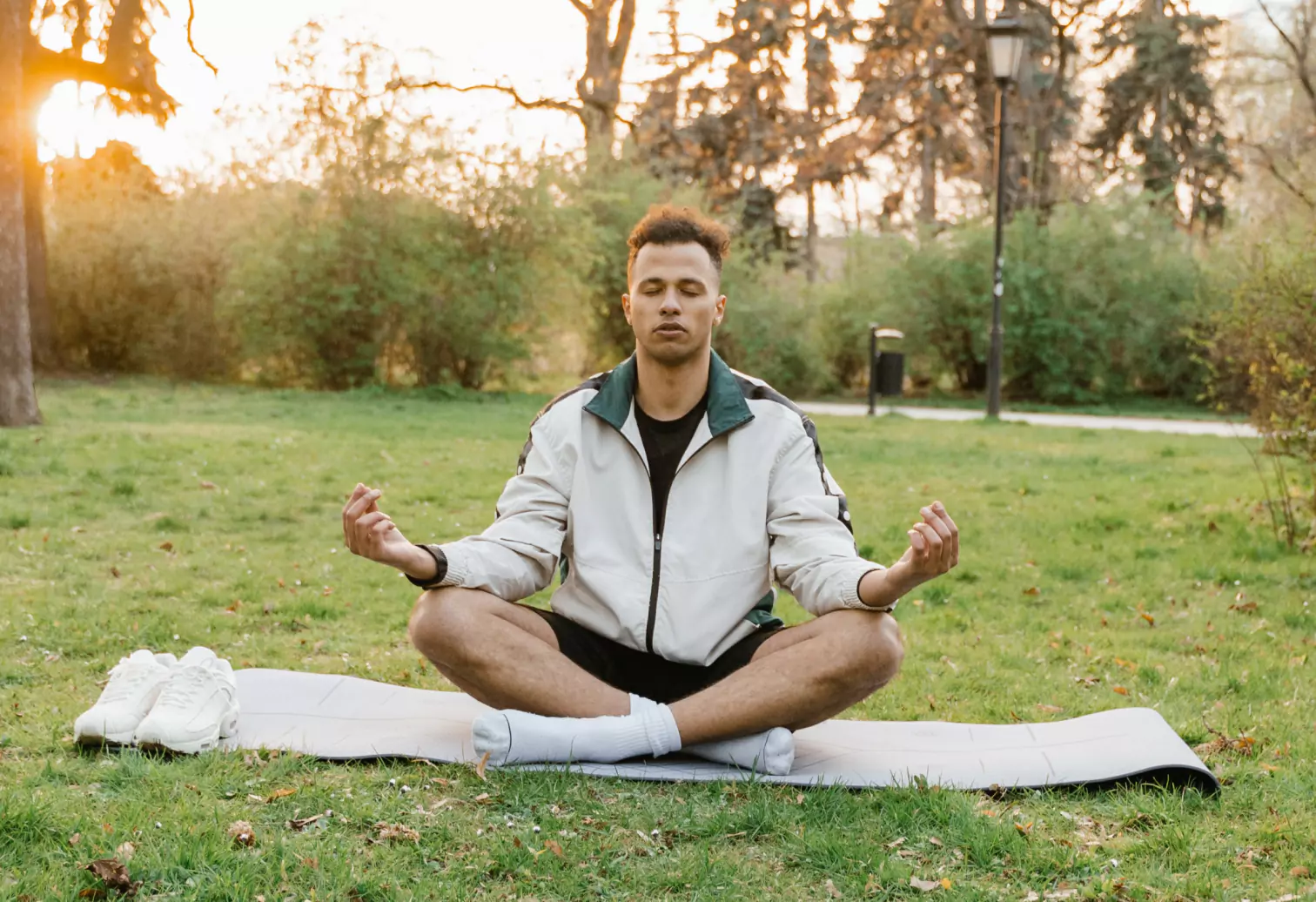 a person meditating outdoors 