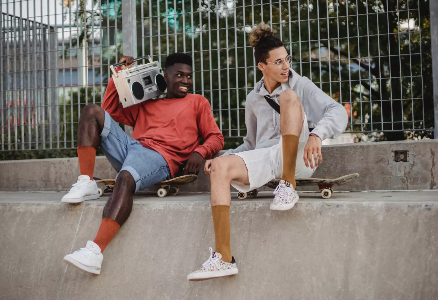 two people sitting on their doors and chilling outdoors