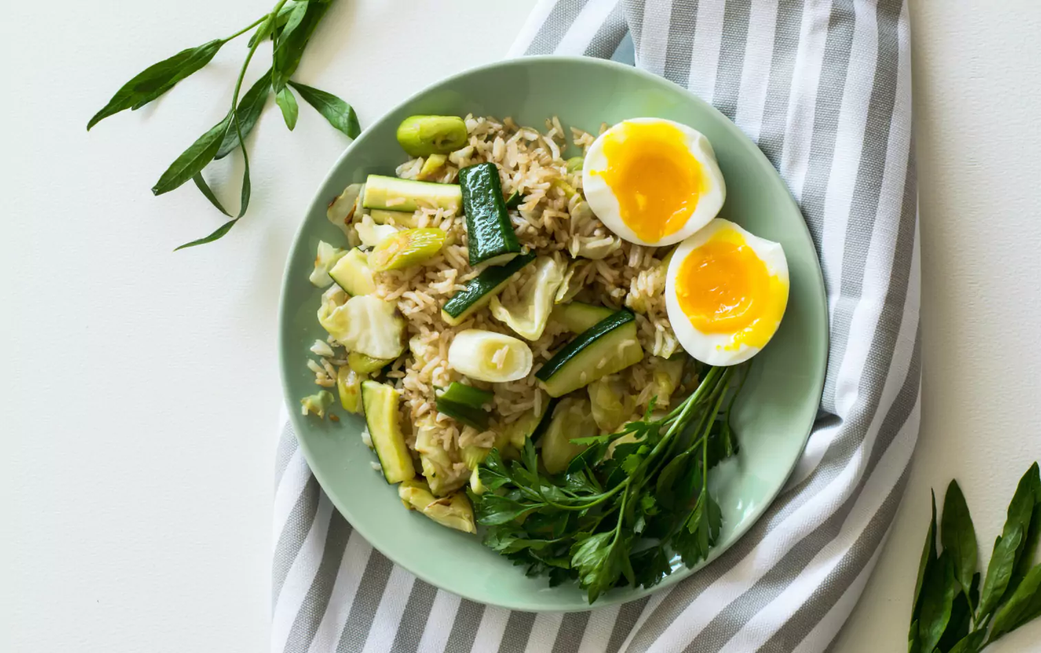 a bowl of rice, veggies and boiled egg