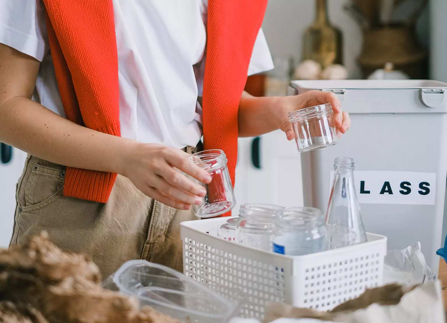 Person organizing glass containers