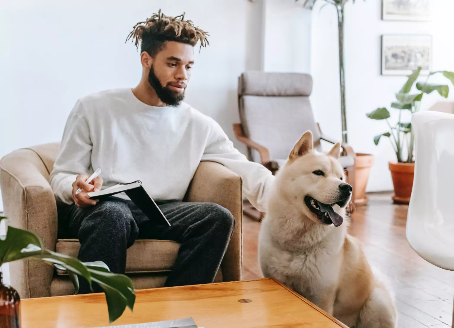 a man petting his dog