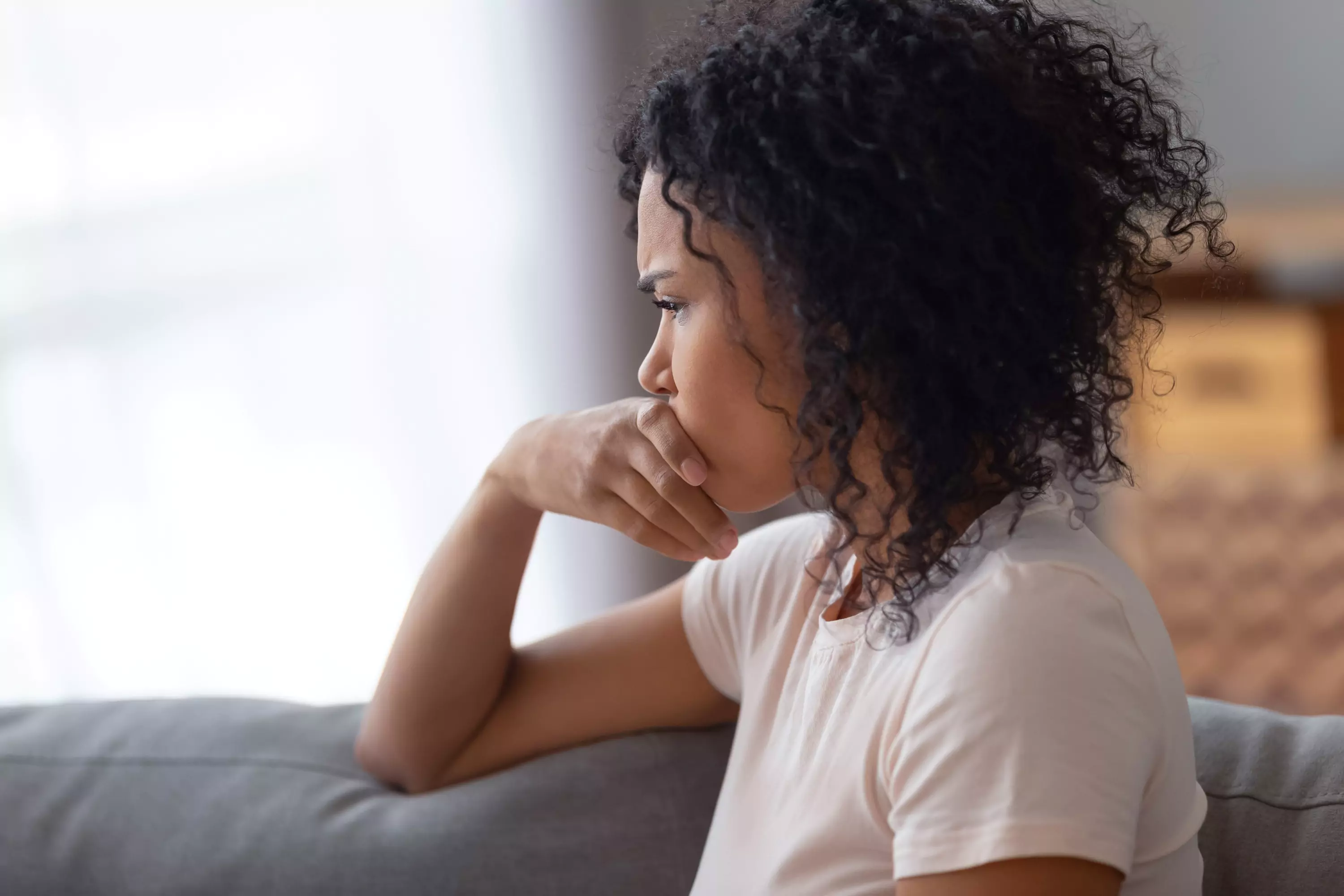 a person sitting, looking stressed