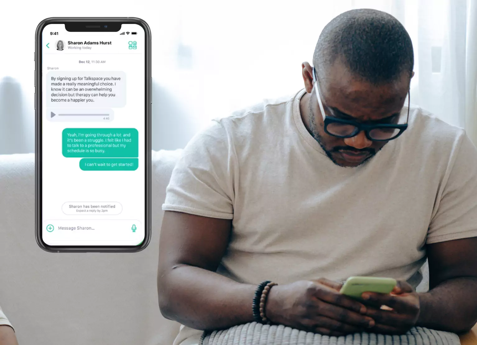 Man with Talkspace app on phone
