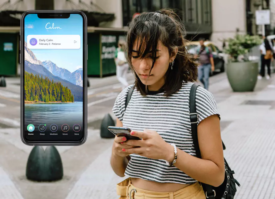 Woman looking at Calm app on phone