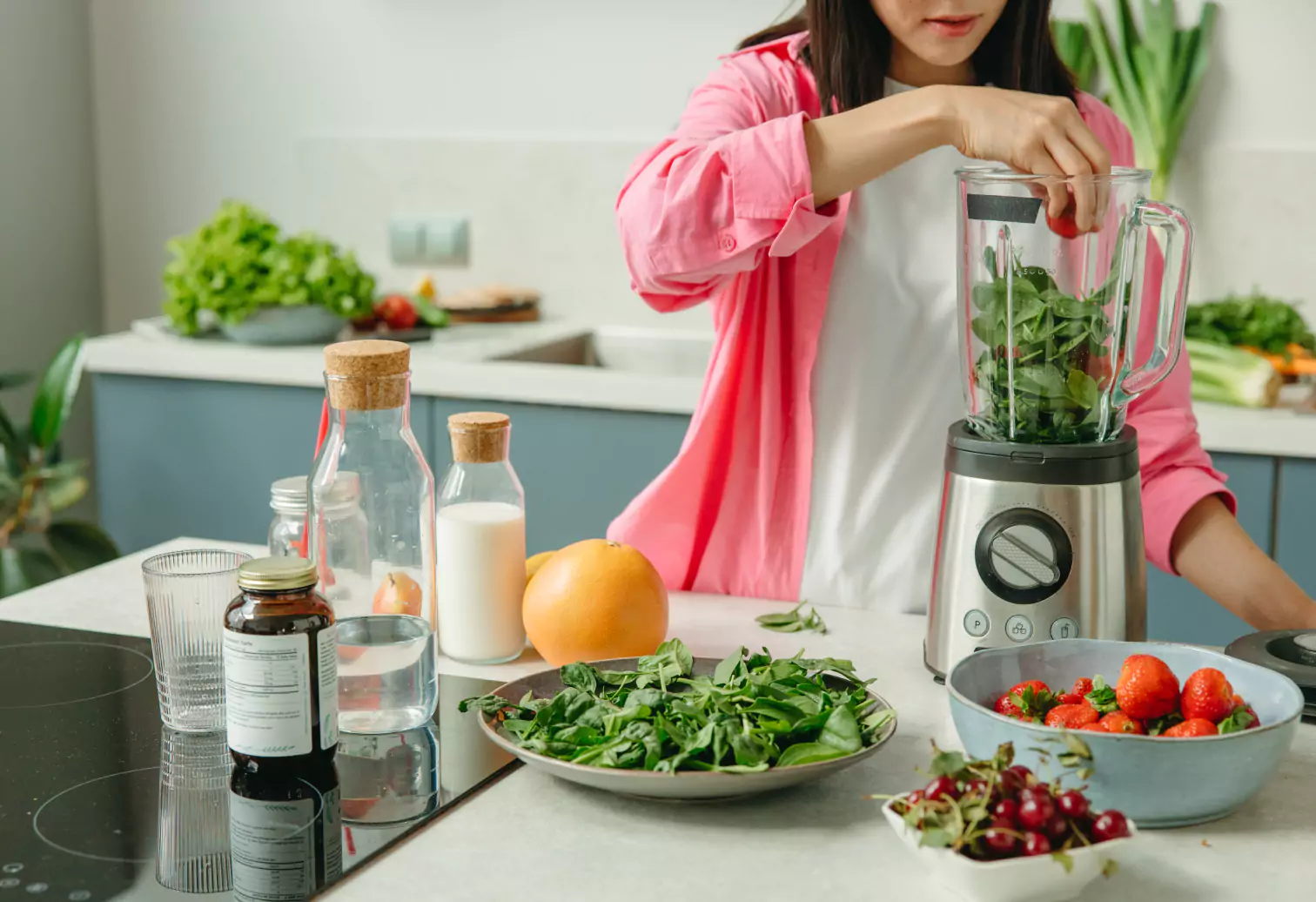 a blender with greens