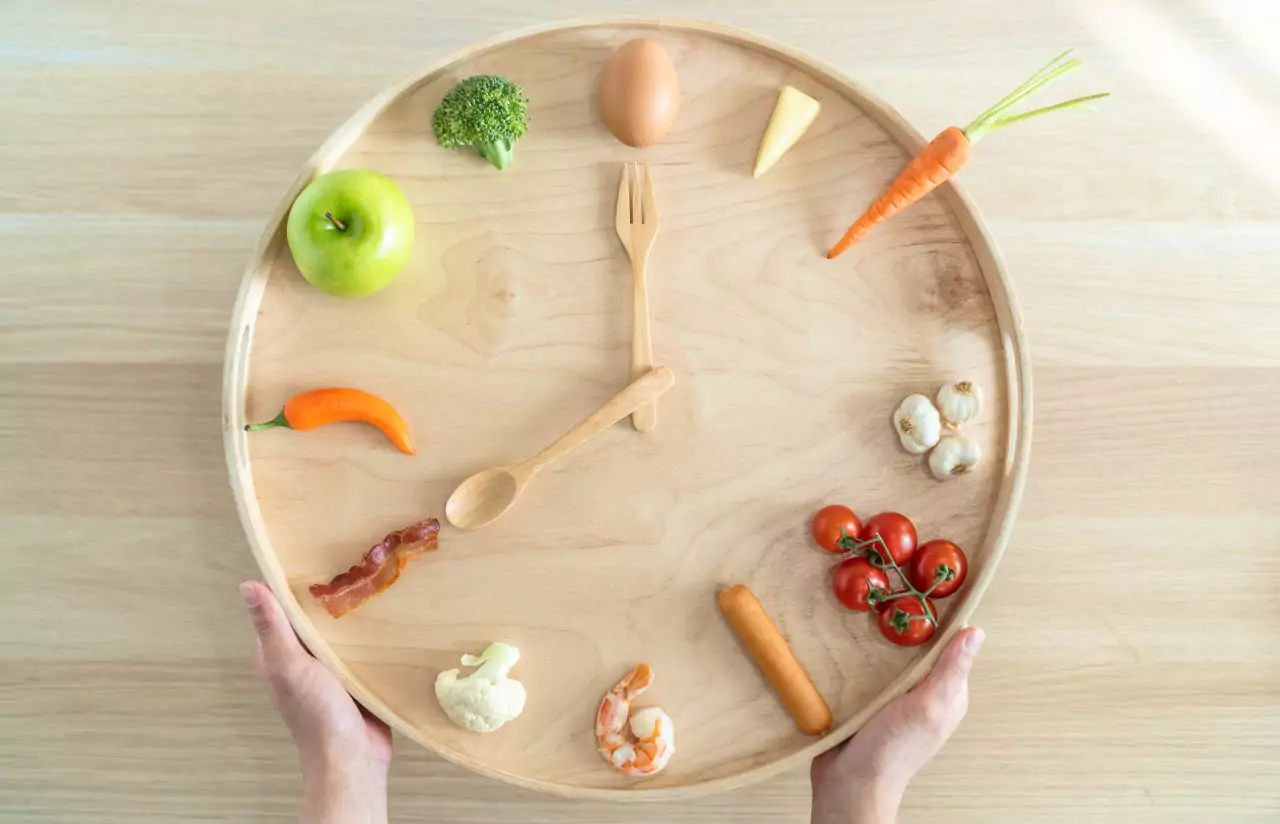 a clock that has different types of food instead of numbers 