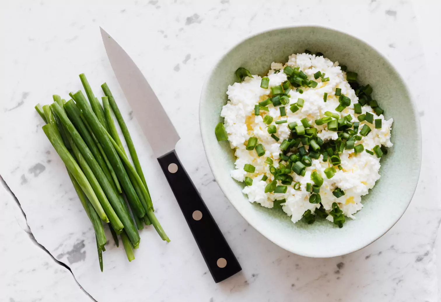 green onions and a bowl of rice