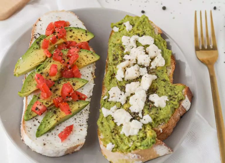 Sourdough toast with avocados, tomatoes, and cheese