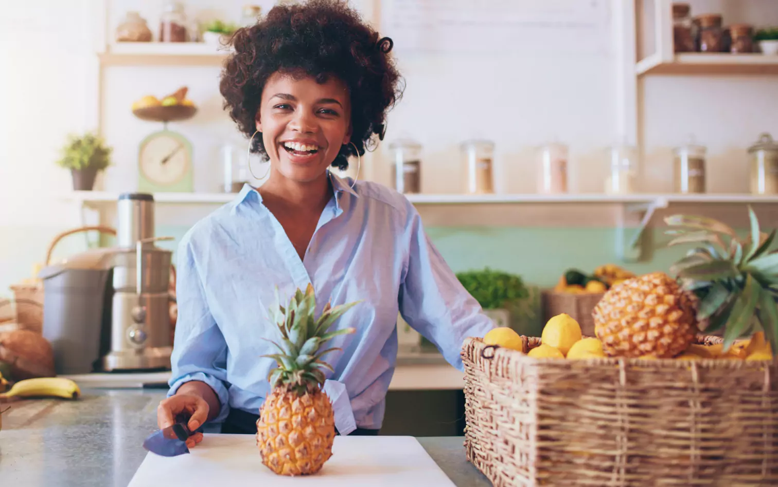 a smiling person in the kitchen 