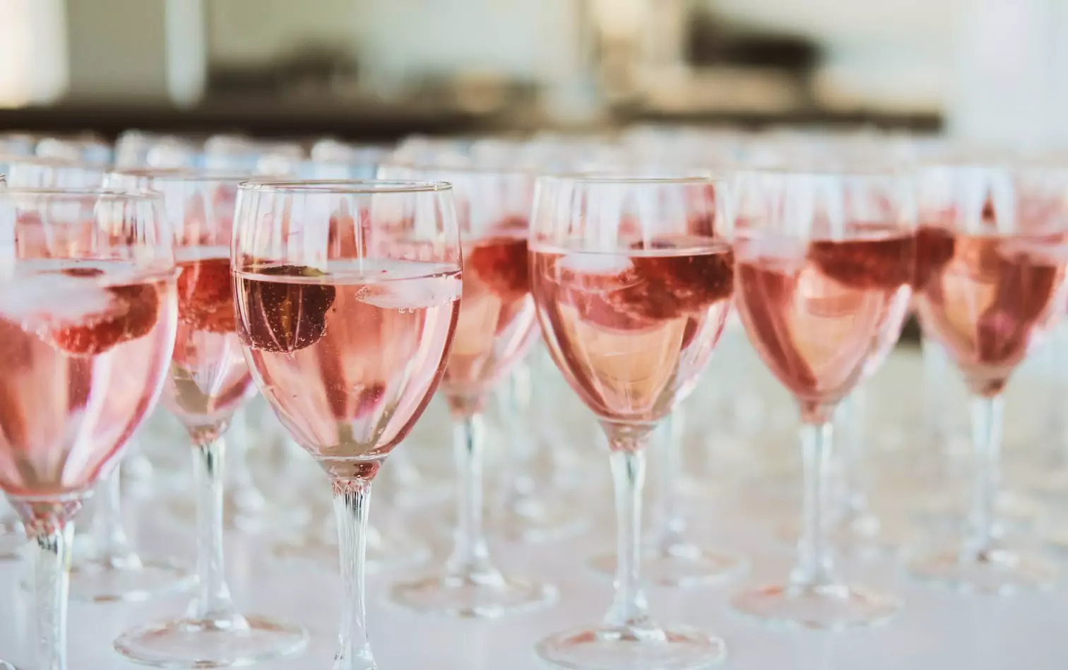 A row of glasses of rose wine