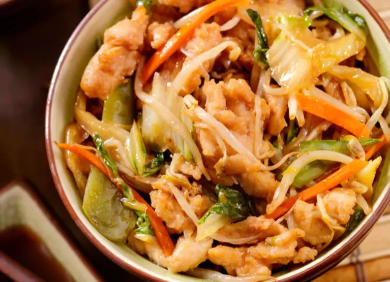 Bowl of stir fry with veggies and meat