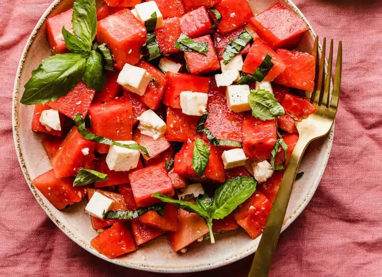 a plate of watermelon salad