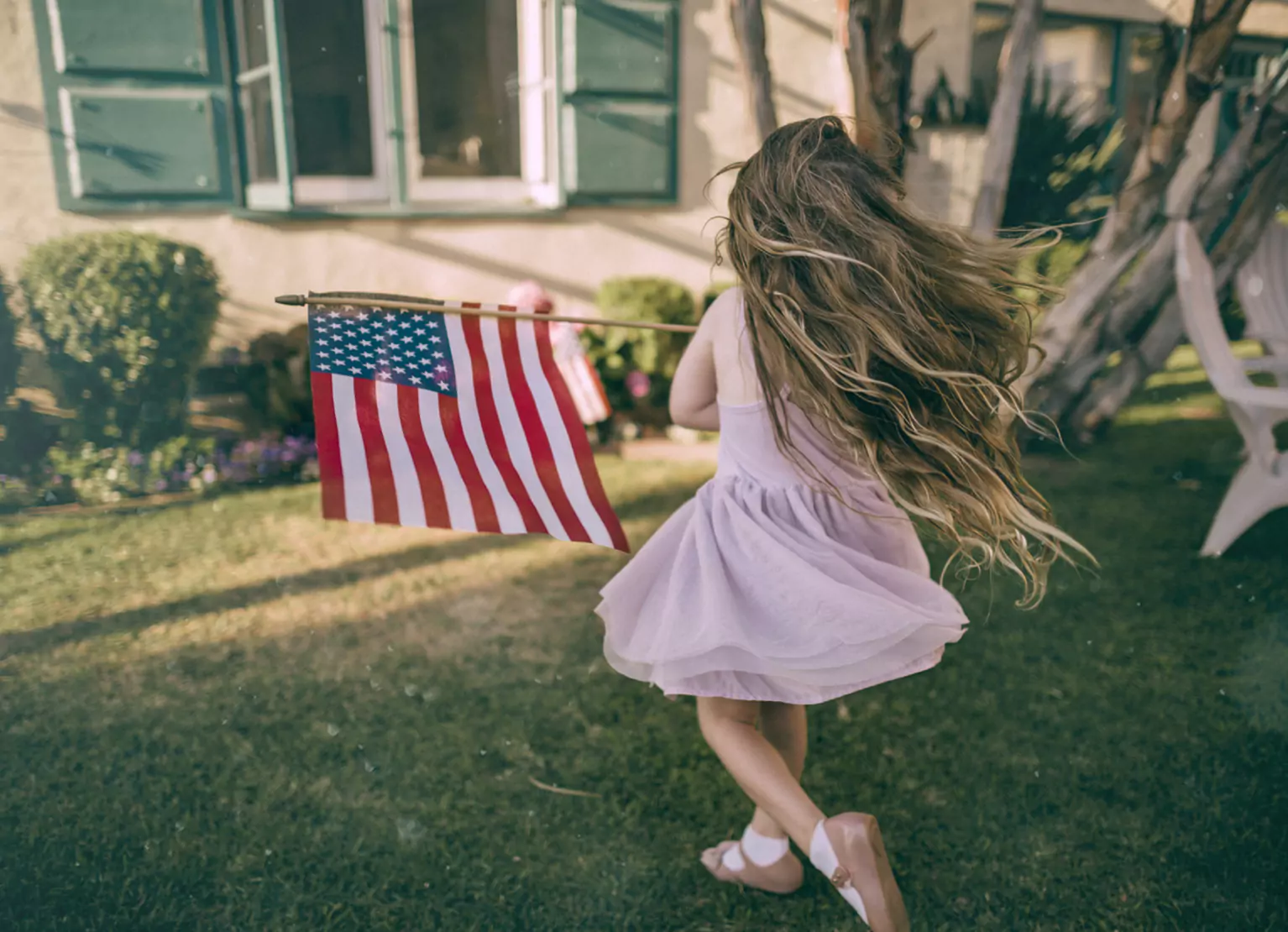 a girl with an american flag