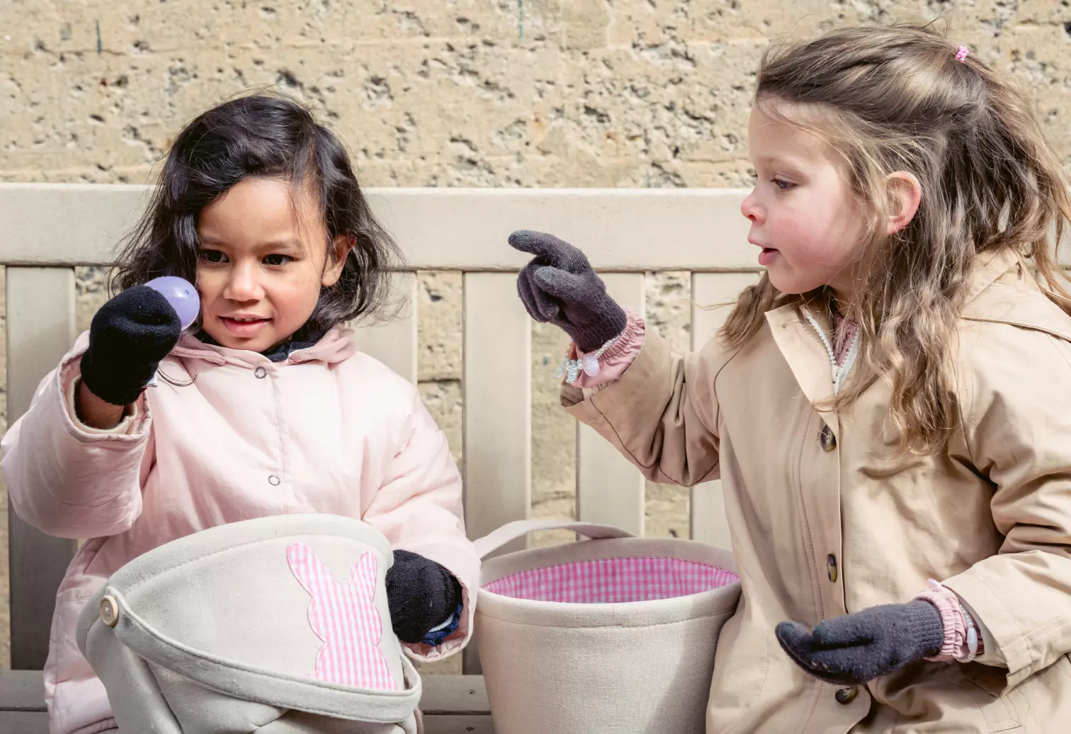 two kids hunting for eggs