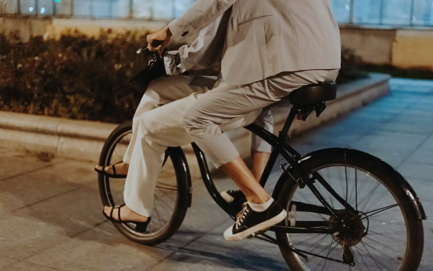 a couple of people riding a bicycle 