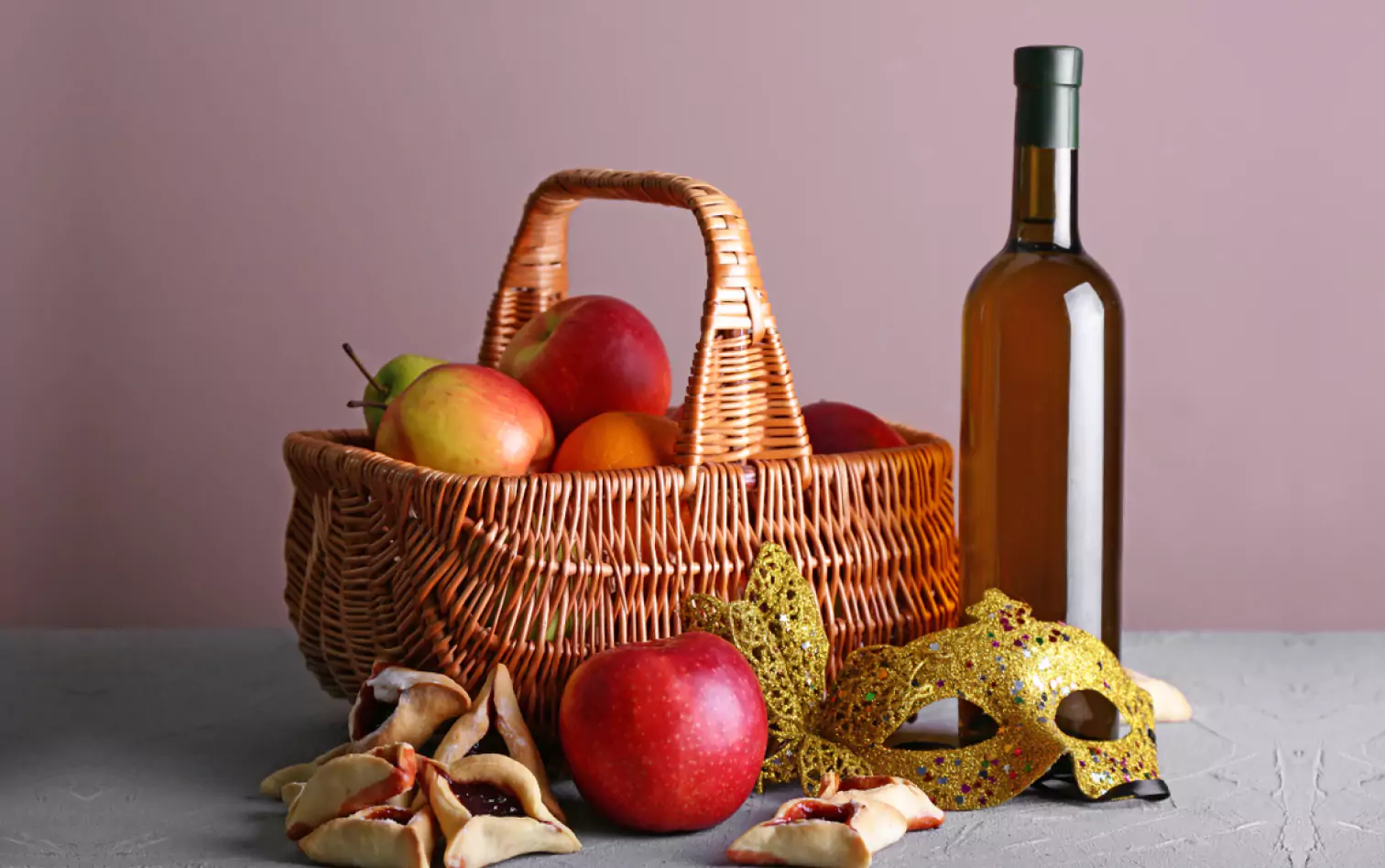 Hamantaschen and  basket of apples