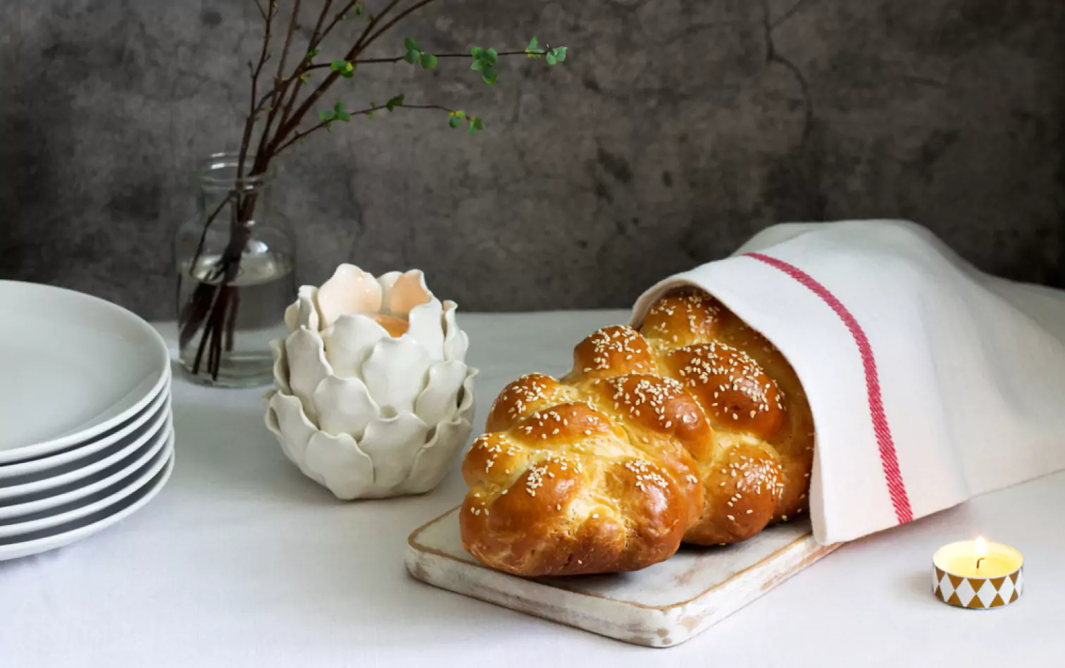 a Challah Bread on a wooden board