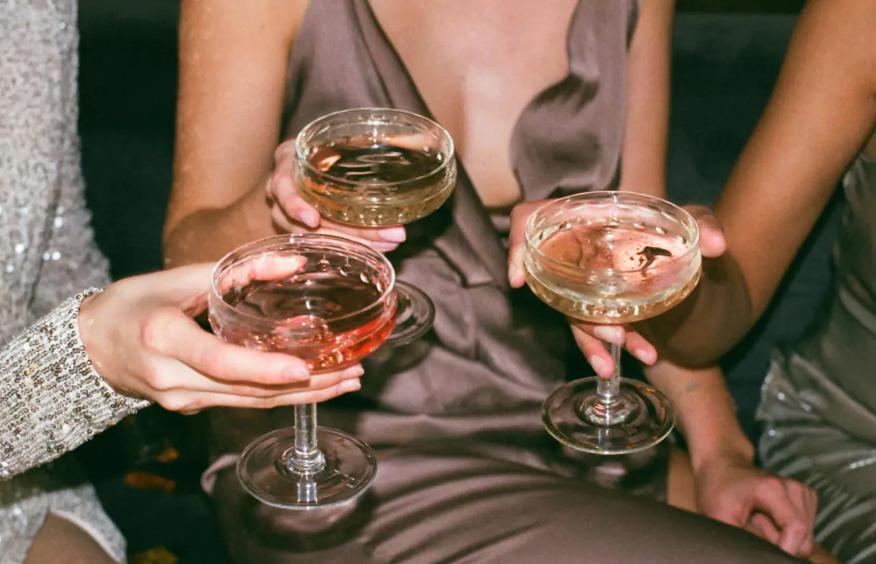 a group of people drinking cocktails 