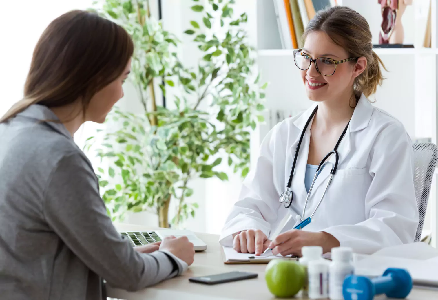 a woman talking with a dietitian