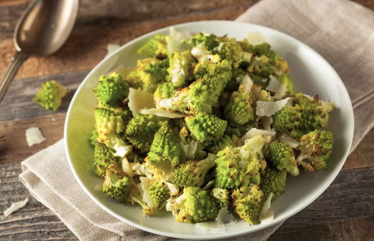 a plate of Brit+Co's Romanesco Holiday Trees With Parmesan Snow