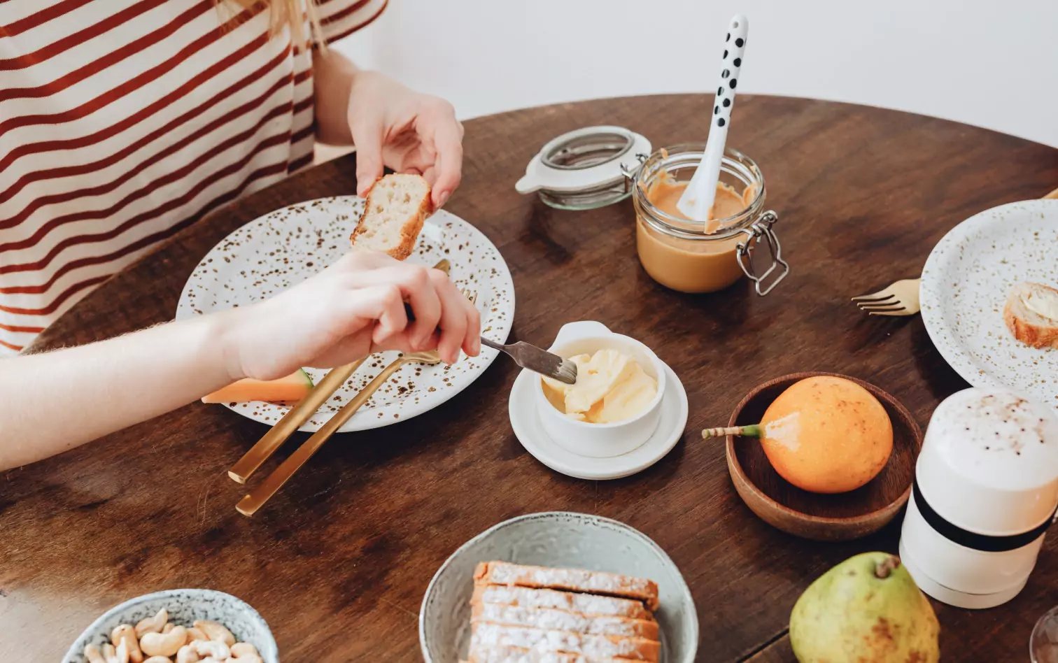 A closeup of a woman eating breakfast