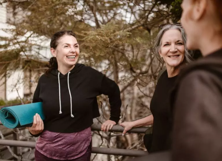 Group of women in workout wear and talking