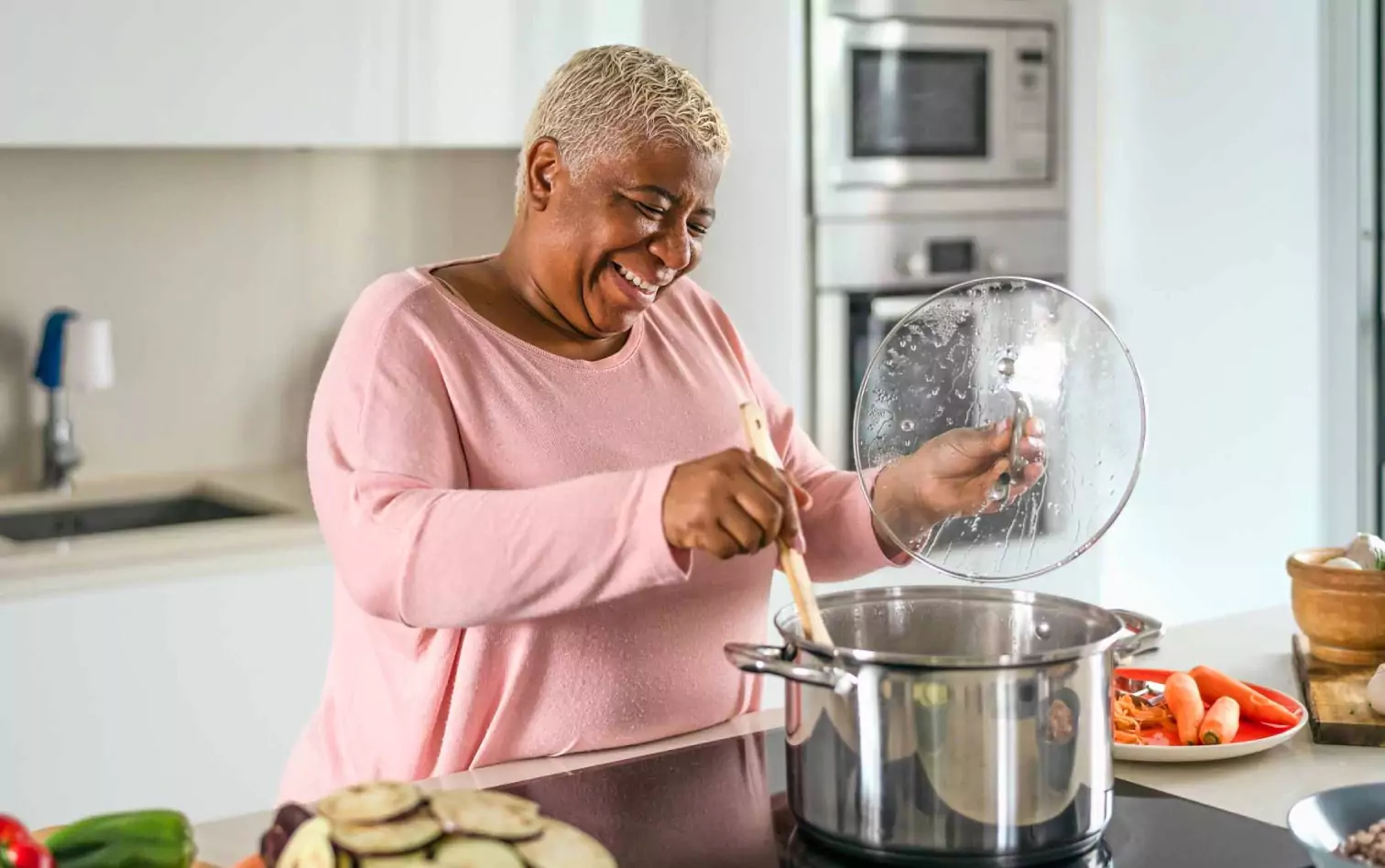 a person cooking and smiling 