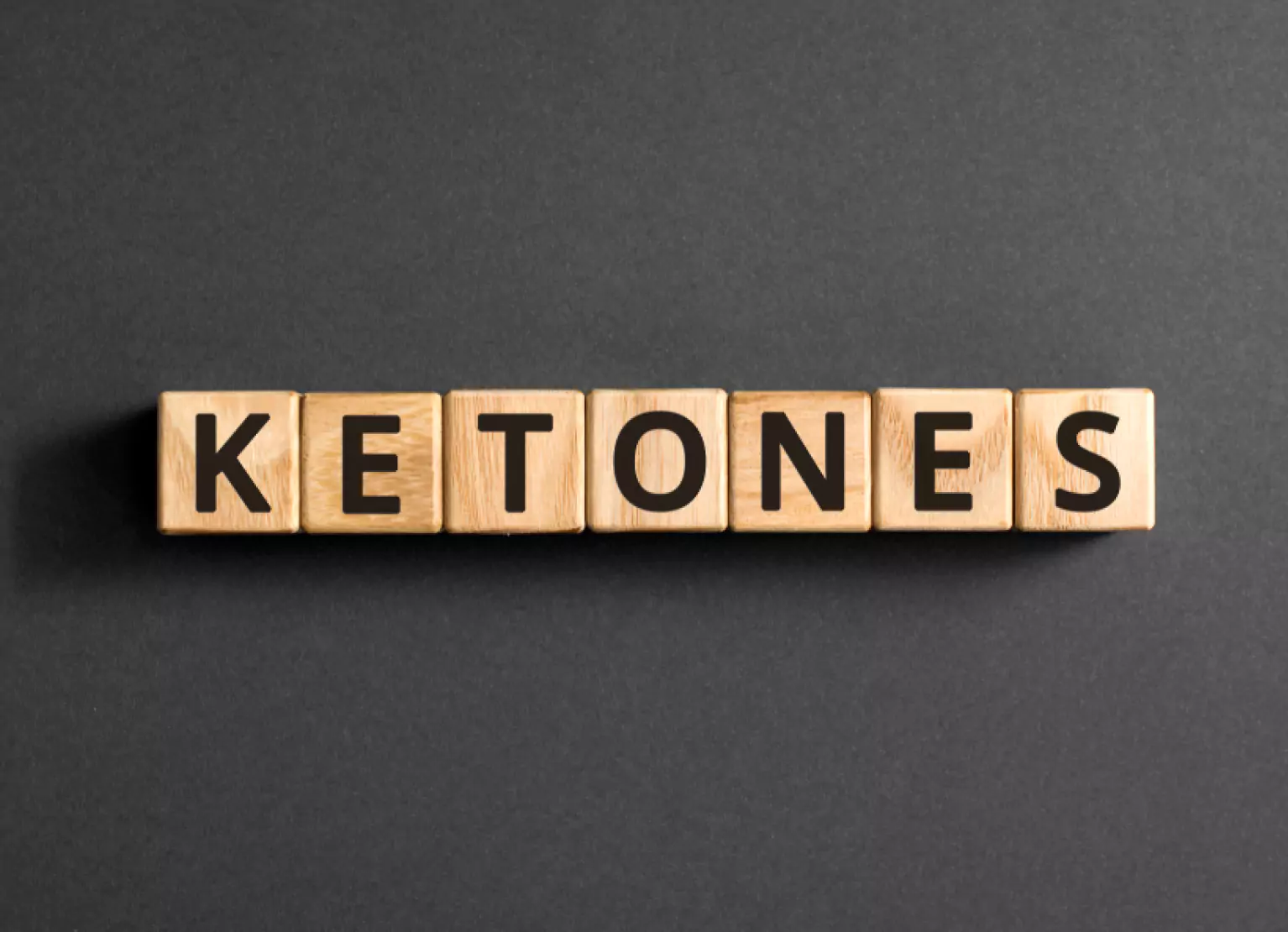 Dice spelling out the word ketones